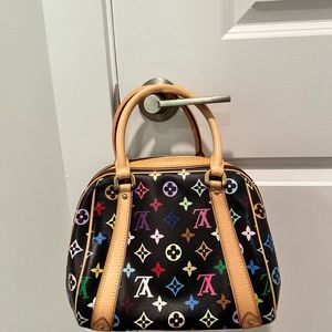 Louis Vuitton
x Takashi Murakami